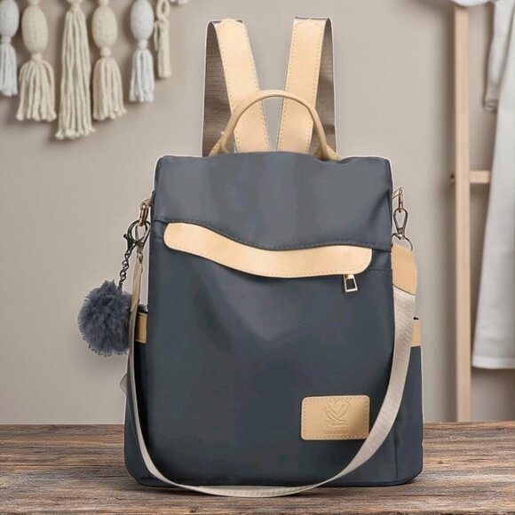 ποΈChic & Versatile Travel Pom-Pom Charm Backpack β Waterproof & Stylish πβ¨ - Picture 7 of 11